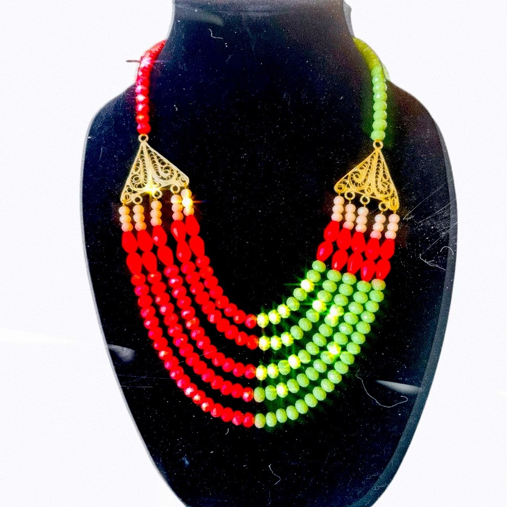 Handbeaded Necklace Green and Red with unique embellishment.